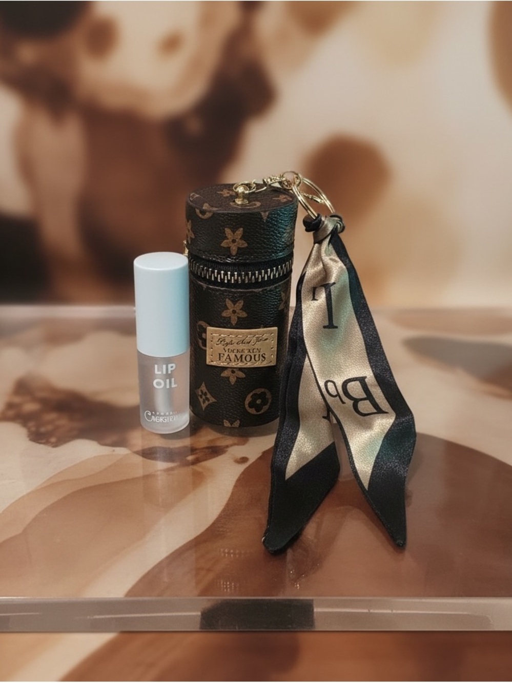 Luxury Monogram Cylinder Keychain Pouch with Silk Scarf with lipgloss.